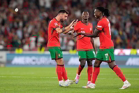 2024–25 UEFA Nations League, Portugal vs Scotland: Portugal's Bruno Fernandes, left, celebrates after scoring his side's first goal